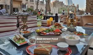 Visitors enjoying popular street food in Bur Dubai at local eateries